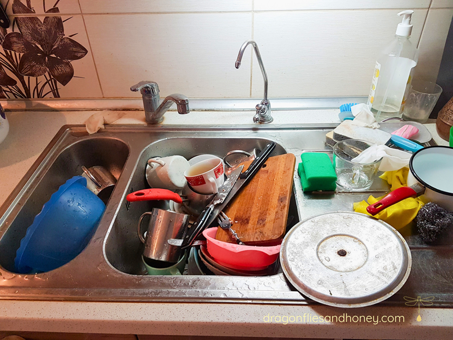 Sink full of dirty dishes