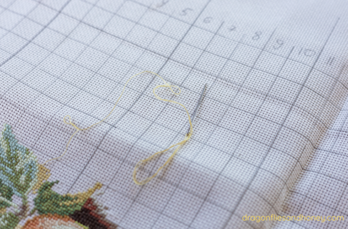 Cross-stitch project with yellow thread