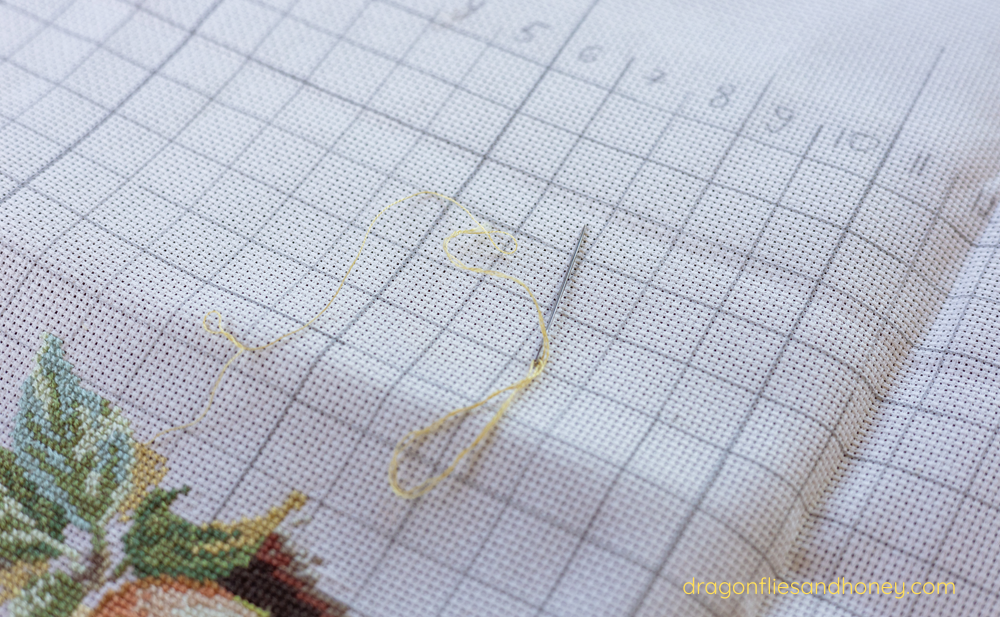 Cross-stitch project with yellow thread