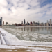 Frozen Lake Michigan with Chicago skyline during late winter in the Midwest.”
